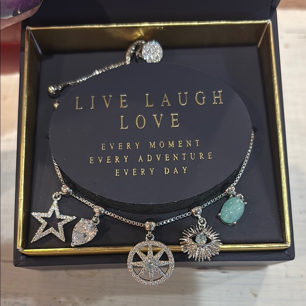 Dazzling Silver Charm Bracelet with Star and Eye Accents